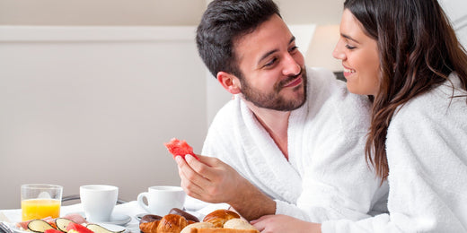 Couples having breakfast in bathing suit.